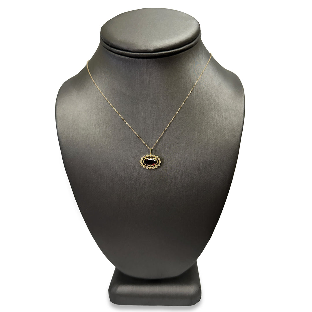 Oval Garnet and Diamond Halo East-West Pendant Necklace in 14k Yellow Gold