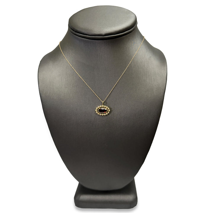 Oval Garnet and Diamond Halo East-West Pendant Necklace in 14k Yellow Gold