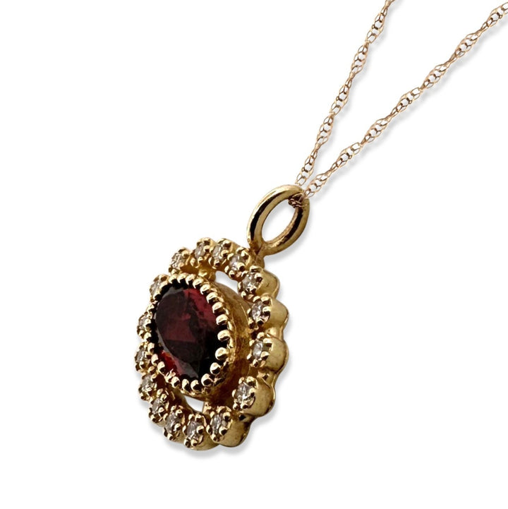 Oval Garnet and Diamond Halo East-West Pendant Necklace in 14k Yellow Gold