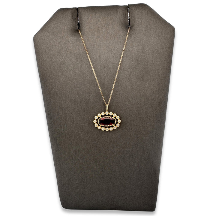 Oval Garnet and Diamond Halo East-West Pendant Necklace in 14k Yellow Gold