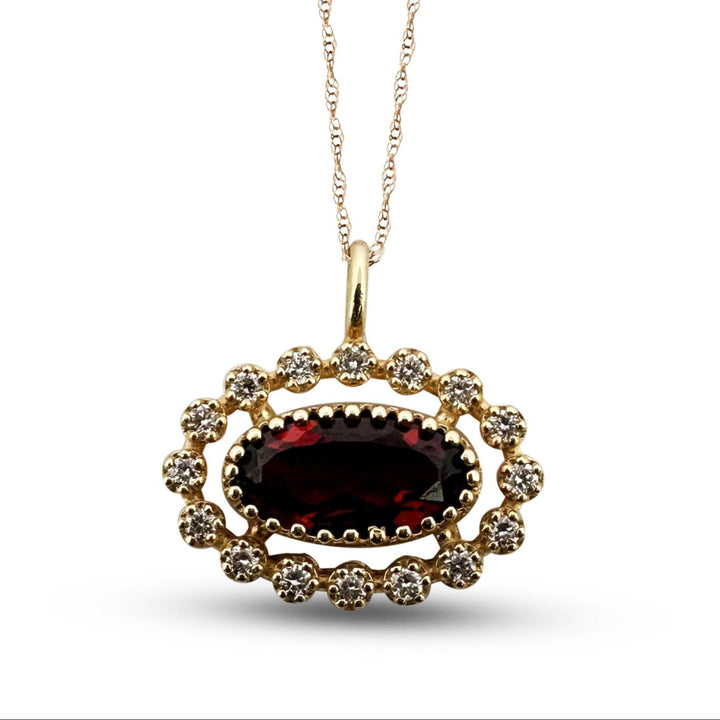 Oval Garnet and Diamond Halo East-West Pendant Necklace in 14k Yellow Gold