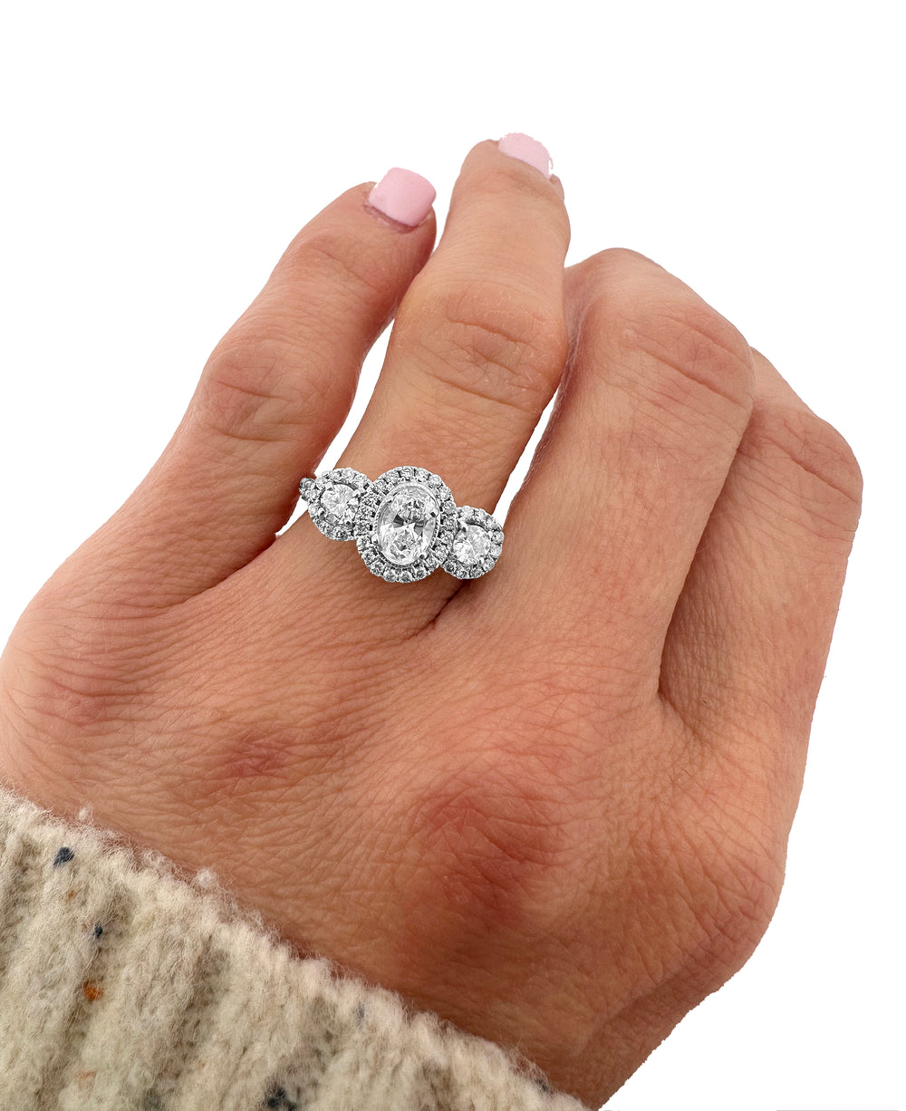 1.16ctw 3-stone Oval and Round Halo Engagement Ring in 14k White Gold, on hand