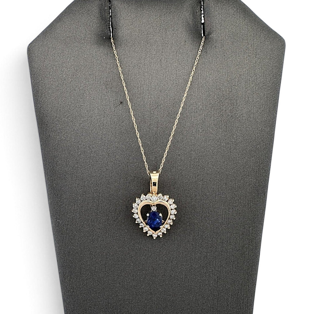 Oval Sapphire And Natural Round Brilliant Diamond Heart Pendant Necklace in 14k Yellow Gold