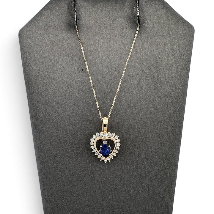 Oval Sapphire And Natural Round Brilliant Diamond Heart Pendant Necklace in 14k Yellow Gold