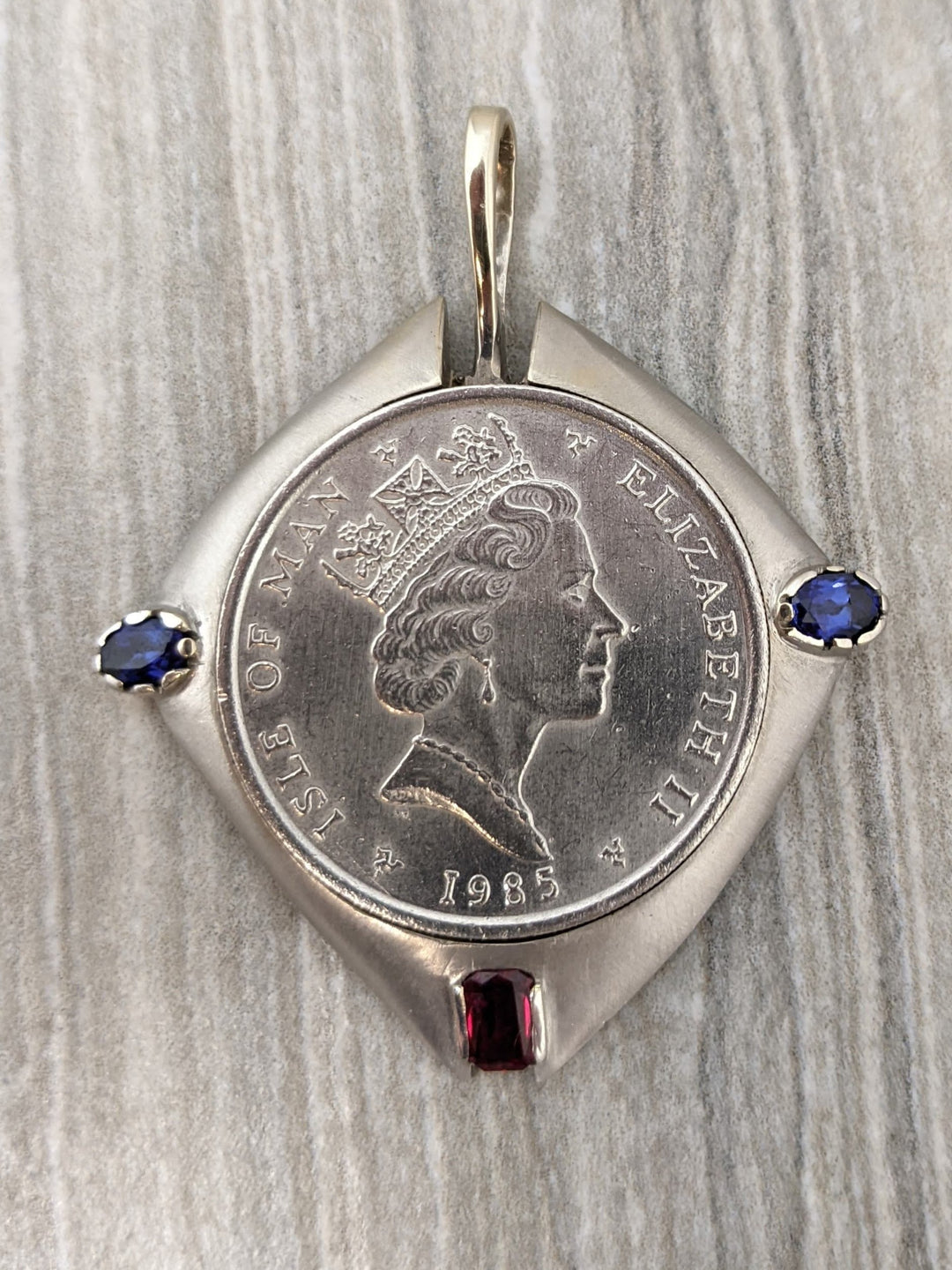1 ozt platinum coin in 14k white gold bezel - Elite Fine Jewelers