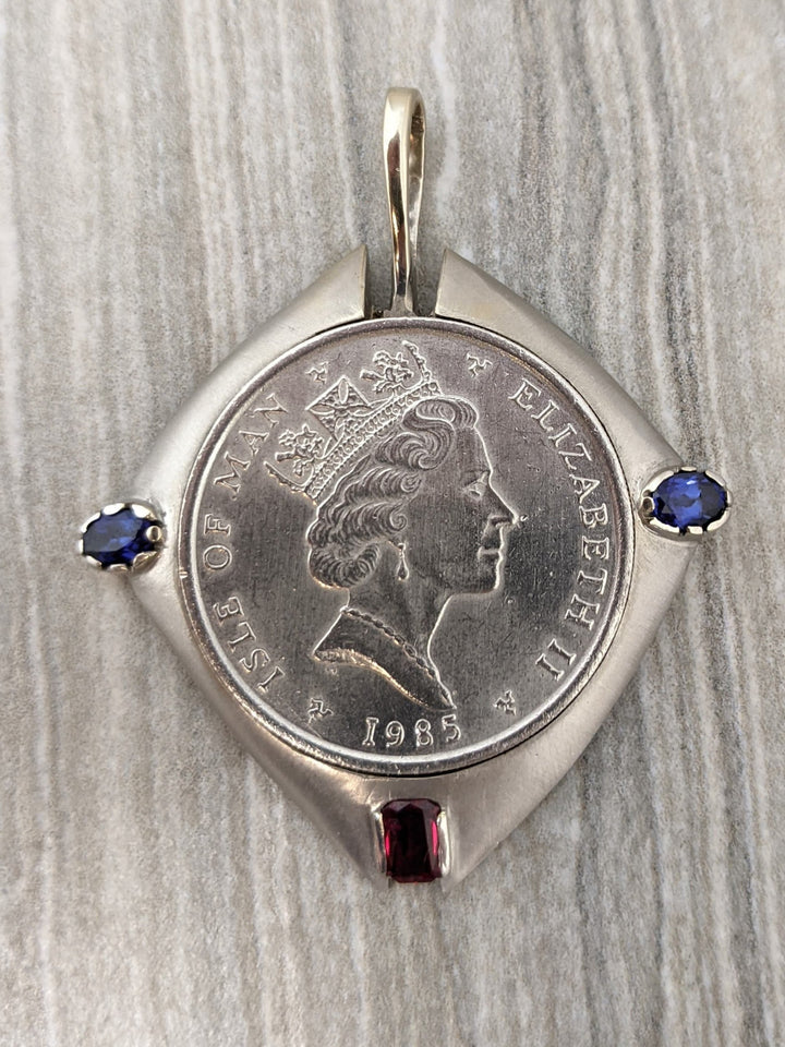 1 ozt platinum coin in 14k white gold bezel - Elite Fine Jewelers