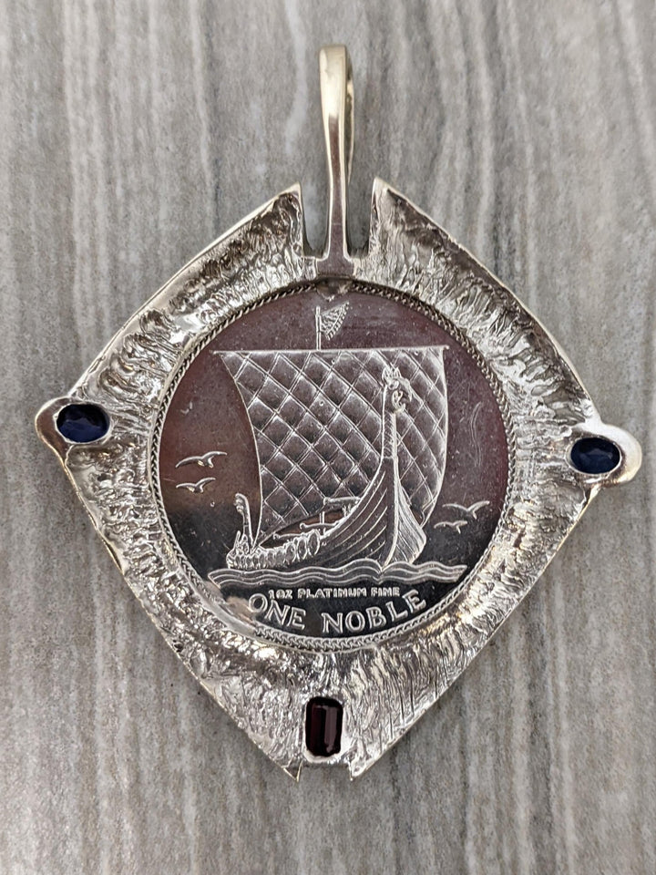 1 ozt platinum coin in 14k white gold bezel - Elite Fine Jewelers