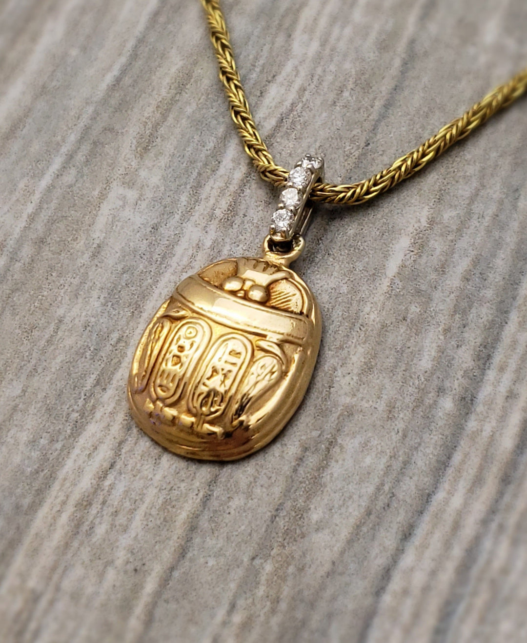 14k yellow gold scarab pendant with diamond bail. - Elite Fine Jewelers