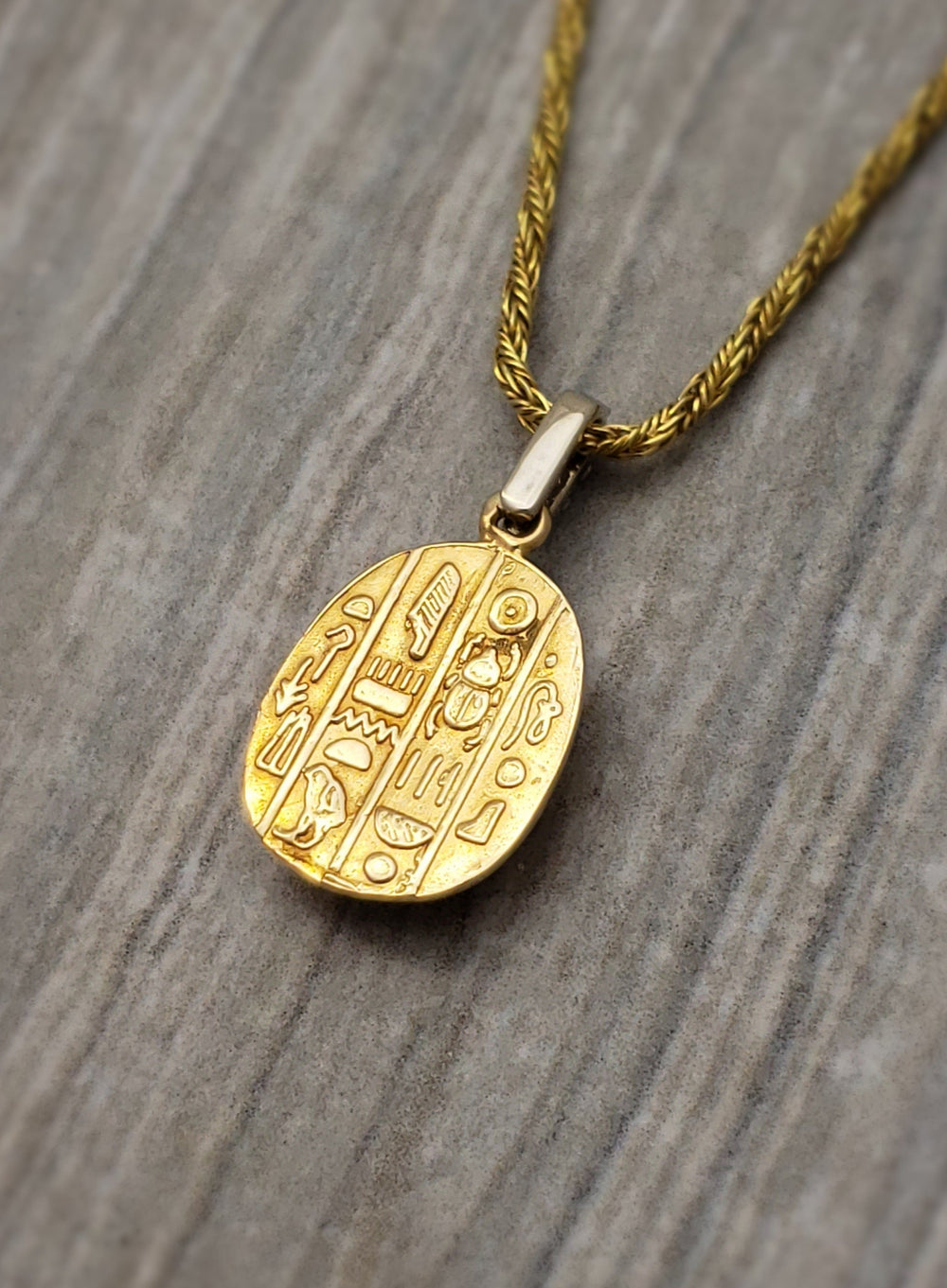 14k yellow gold scarab pendant with diamond bail. - Elite Fine Jewelers