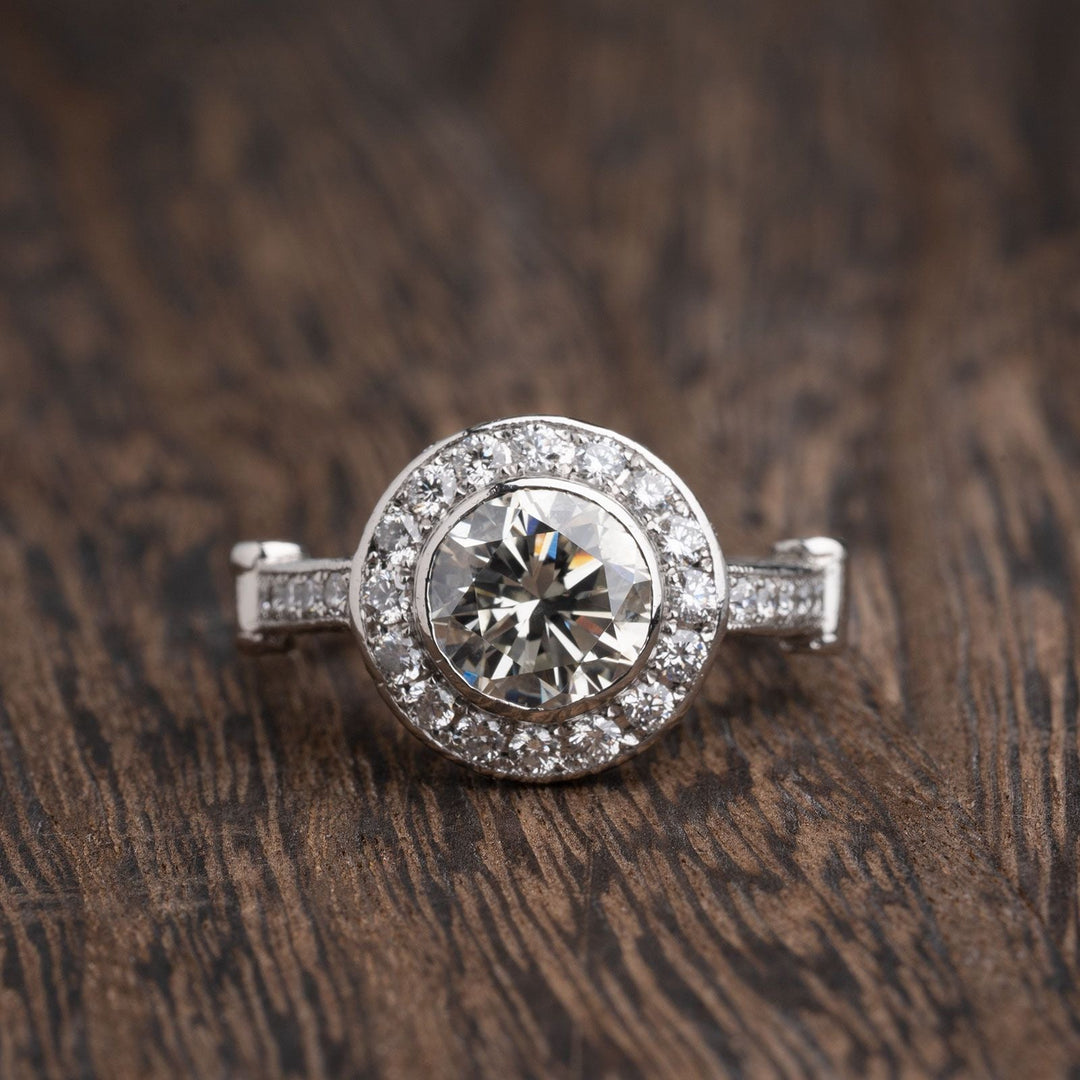 4 carat bezel set round brilliant diamond engagement ring Diamonds down shank and diamond halo