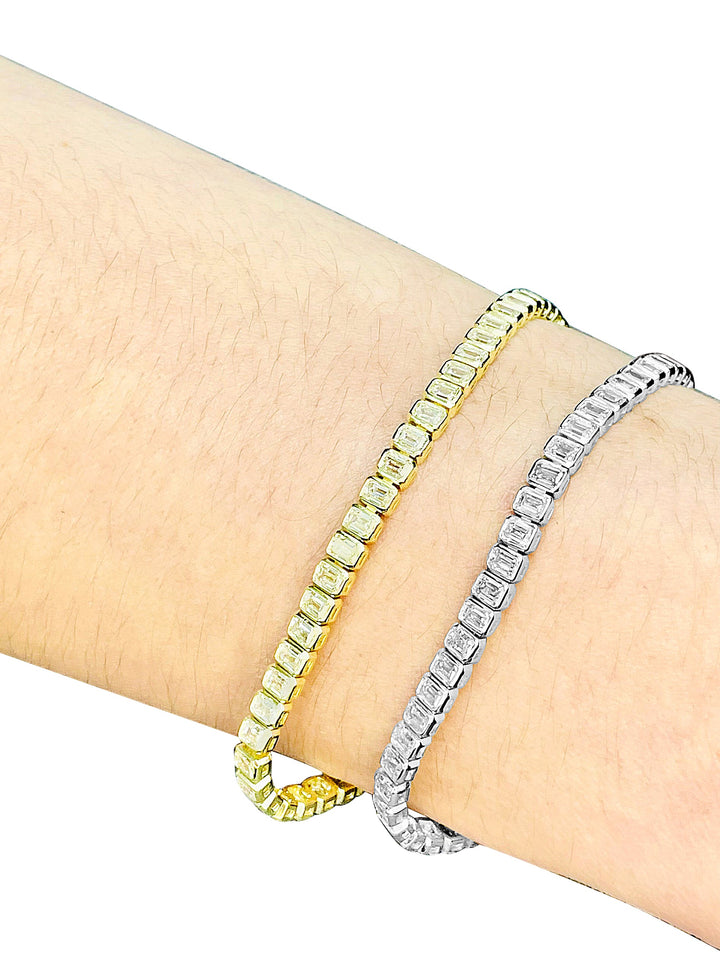 5.82ctw Emerald Cut Diamond Bezel-Set Tennis Bracelet in 14k Yellow Gold, on wrist - Elite Fine Jewelers