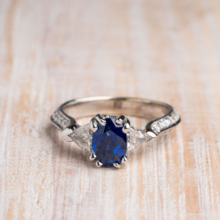 Oval Blue Sapphire with Trillion and Round Diamonds 18k White Gold Ring