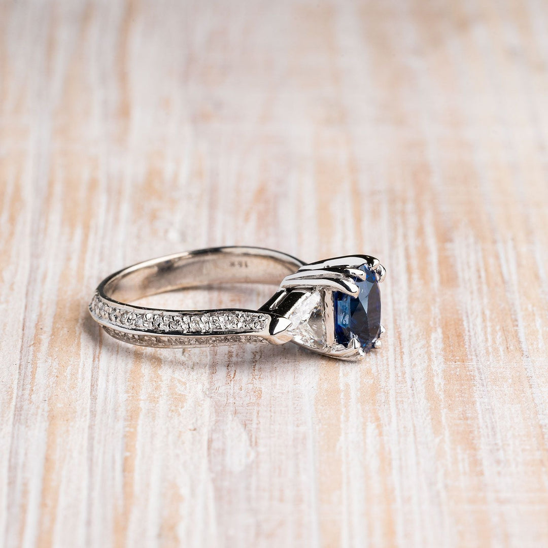 Oval Blue Sapphire with Trillion and Round Diamonds 18k White Gold Ring, side view