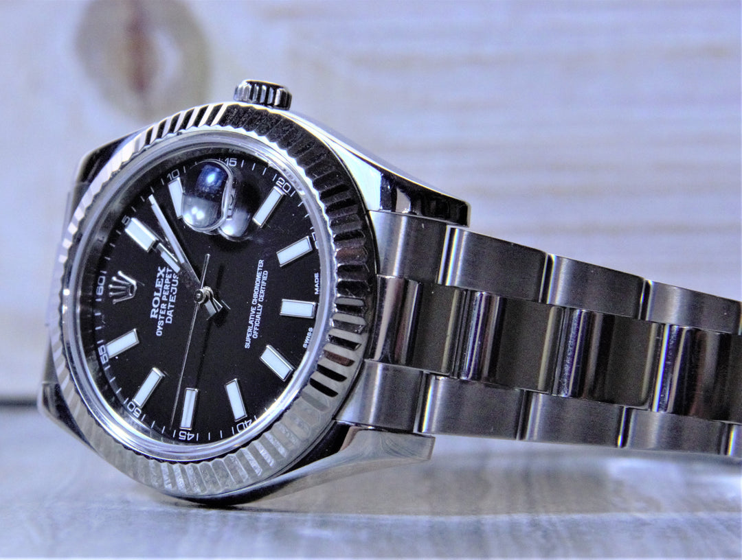 Sold Rolex Datejust II with a black dial and fluted bezel. - Elite Fine Jewelers