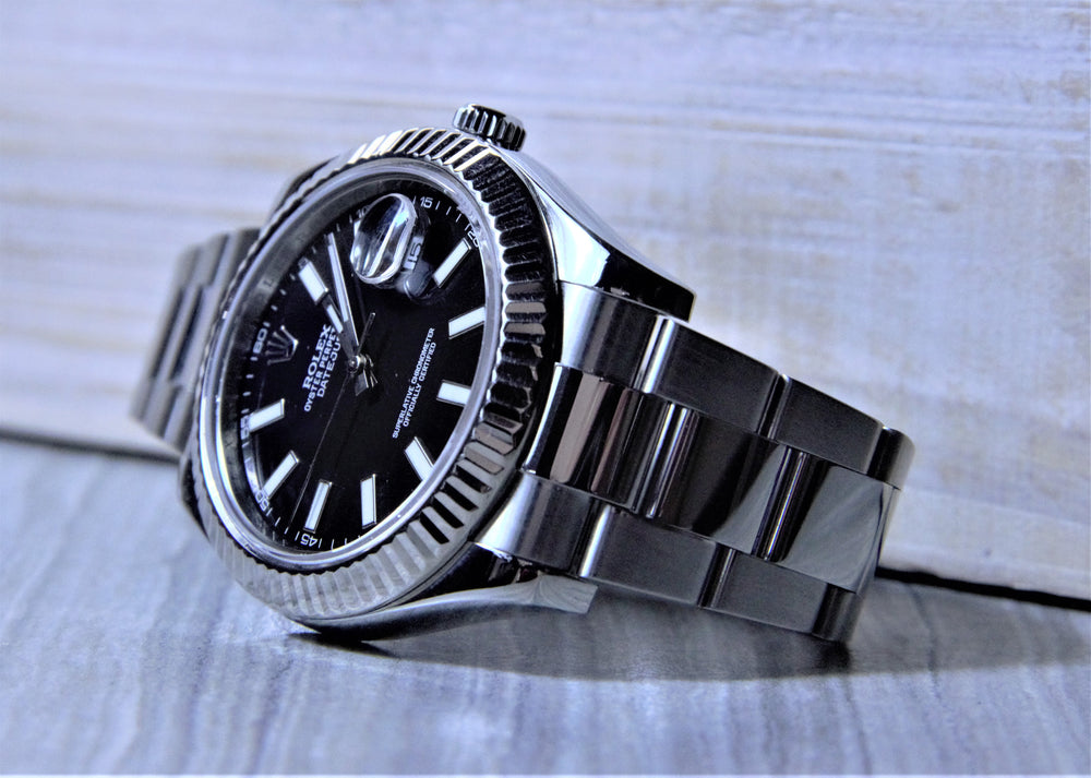 Sold Rolex Datejust II with a black dial and fluted bezel. - Elite Fine Jewelers
