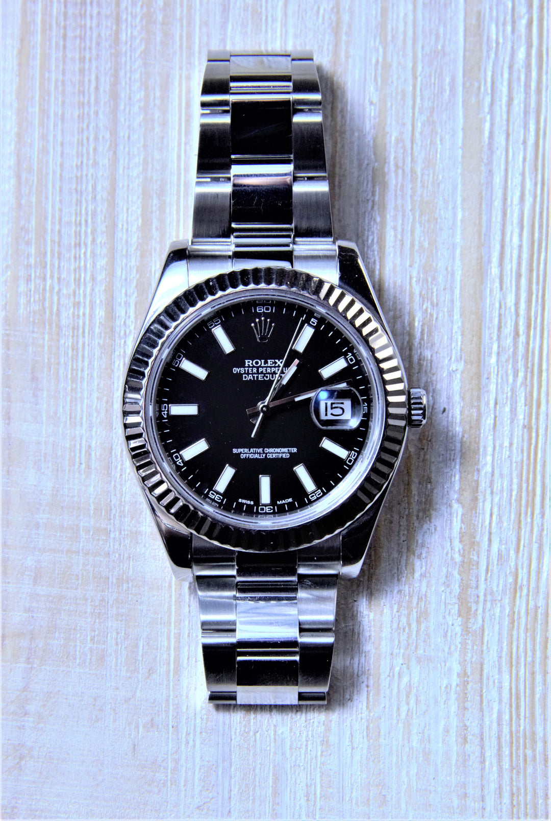 Sold Rolex Datejust II with a black dial and fluted bezel. - Elite Fine Jewelers