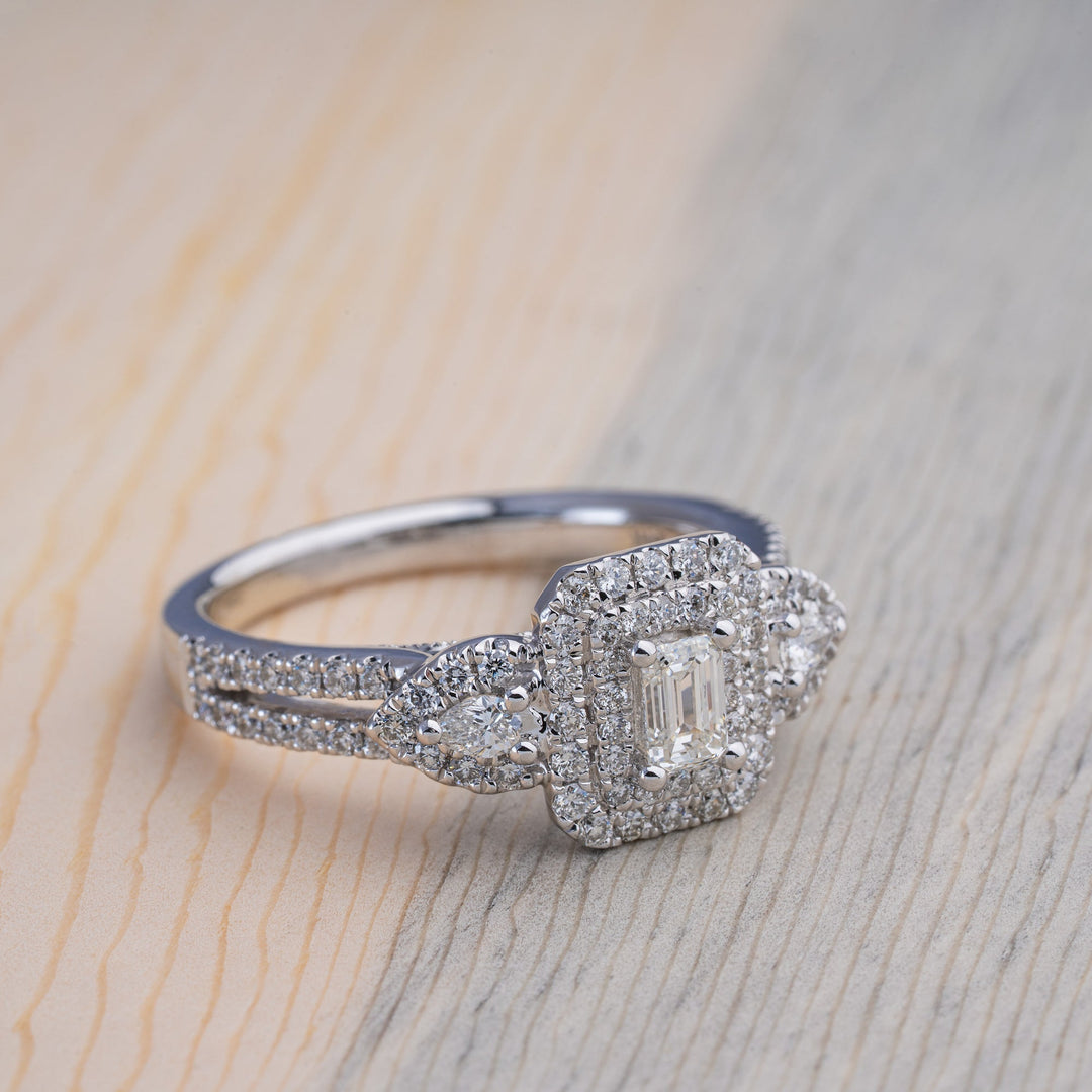 Stunning Emerald Cut Diamond With Double Halo and Pear Accents - Elite Fine Jewelers
